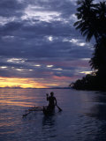Native Fisherman in Outrigger Canoe, Indonesia Photographic Print by Yvette Cardozo