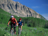 Two Women Mountain Biking, Snodgrass Mountain, CO Photographic Print by Tom Stillo