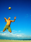 Man Playing Volleyball, FL Photographic Print by Jeff Greenberg