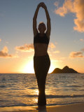 Woman Stretching on Beach Photographie par Tomas del Amo
