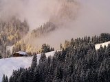 Lone Cabin on Misty Snowy Hill Photographic Print