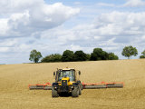 Tractor Rolling a Recently Ploughed Field Near Moreton-In-Marsh, England Fotografie-Druck von Martin Page