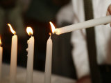 Boy Lighting Candles at Bar Mitzvah Photographie par Bill Keefrey
