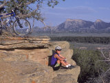 Woman Mountain Biking, Sitting Photographic Print by Amy And Chuck Wiley/wales