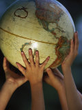 Kids Holding Globe Photographic Print by Guy Crittenden