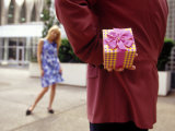 Man with Gift for His Girlfriend Photographic Print by Henryk T. Kaiser