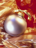 Christmas Ornament withGold Ribbons and Red Tissue Photographic Print by Eric Kamp