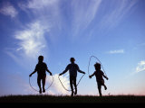 Silhouette of Children Playing Outdoors Fotografie-Druck von Mitch Diamond