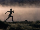 Silhouette of Woman Trail Running, CO Photographie par Bob Winsett