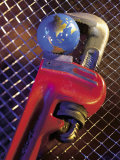 Wrench Holding Globe Photographic Print by Ellen Kamp