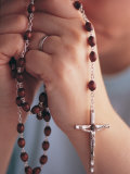 Woman Praying with Rosary Beads Photographic Print by Jim Corwin