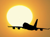 Silhouette of Airplane with Sun Photographic Print by David Davis
