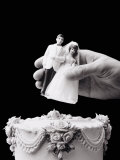 Female Hand Holding Wedding Cake Topper Photographic Print by Howard Sokol