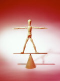 Wooden Figure on Balance Board Photographie par Michelle Joyce