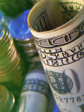 Rolled $100 US Bill with Coins in Background Photographic Print by Eric Kamp