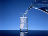 Pitcher of Water Poured Into a Glass Photographic Print by Henryk T. Kaiser