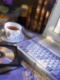Laptop Computer, Cd-Rom, Cup of Tea, and Books Photographic Print by Eric Kamp