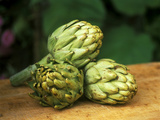 Globe Artichoke "Camus" on Wooden Table Photographic Print by Akene Sarl