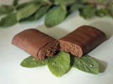Chocolate Nutrition Bar on Mint Leaves Photographic Print by Chris Rogers