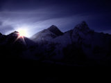 The Sun Rising over Snow-Covered Mount Everest Photographic Print by Tim Laman