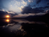 Sunset Sky Filled with Clouds is Reflected in the Water Photographic Print by Sam Abell