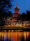Colored Lamps Outlining the Pagoda at Tivoli are Reflected in the Water Photographic Print by Sisse Brimberg