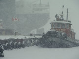 A Tugboat and Freighter at Dock in a Snowstorm Photographic Print by Medford Taylor