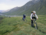 Bikers Travel Across the Rough Terrain and Melt Ice of the Alaska Range Photographic Print by Bill Hatcher
