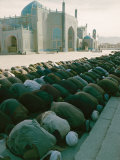 Afghan Men Pray Near the Mosque in Mazar-I-Sharif Photographic Print by Thomas J. Abercrombie