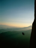 A Rock Climber from the 90 Degree Face of a Mountain Wall Photographic Print by Barry Tessman