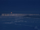 The Moon Rises over an Iceberg in the Bellingshausen Sea Photographic Print by Maria Stenzel