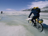 Bikers Travel Across the Rough Terrain and Melt Ice of the Alaska Range Photographic Print by Bill Hatcher