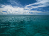 Clouds in Blue Sky over Clear Calm Blue Waters Photographic Print by Wolcott Henry