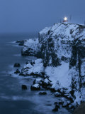 A Lighthouse Atop Snow-Covered Cliffs on Notsuke Bay Photographic Print