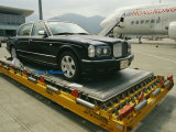 Luxury Bentley Unloaded from an Airplane at Chek Lap Kok Airport Lámina fotográfica por Eightfish Luxury Bentley Unloaded from an Airplane at Chek Lap Kok Airport Lámina fotográfica por Eightfish
