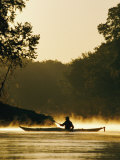 A Kayaker Paddles the River in a Morning Mist Photographic Print by Skip Brown
