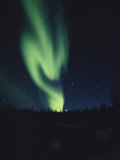 The Aurora Borealis in the Northern Night Sky Photographic Print by Paul Nicklen