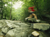 Panned View of Man Leaping over Rocky Stream on the Appalachian Trail Photographie par Skip Brown