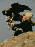 A Kazakh Man Supports His Trained Golden Eagle Photographic Print by David Edwards