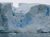 Calving Ice Falls from an Ice Formation into Water Photographic Print by Maria Stenzel