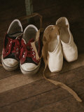 A Pair of Ballet Toe Shoes Rest Next to a Pair of Tennis Shoes Fotografie-Druck von Jodi Cobb