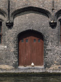Two Ducks Sit in Doorway That Opens Directly onto a Canal Photographic Print by Joseph H. Bailey
