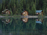 Lake Ohara Lodge Cabins Reflected on the Surface of Lake Ohara Photographic Print by Michael Melford