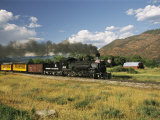 Old Locomotive with Billowing Black Smoke in Hilly Countryside Lámina fotográfica por Richard Nowitz Old Locomotive with Billowing Black Smoke in Hilly Countryside Lámina fotográfica por Richard Nowitz
