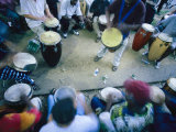 The Blur of a Frenzied Beat in a Circle of Spontaneous Drumming Photographie par Stephen St. John