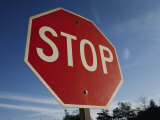 A Red Stop Sign against a Blue Sky Photographic Print by Stephen St. John