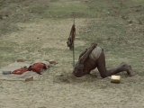 A Sadhu, or Holy Man, Buries His Head in a Feat of Breath Control Demonstrating His Mastery of Yoga Photographic Print by George F. Mobley