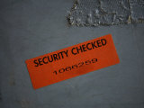 A Security Sticker is Attached to a Piece of Baggage Photographie par Stephen Alvarez