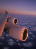 A Close View of the Wing and Jet Engines of a Plane in Flight Photographie par Paul Chesley