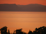 Sunset Paints the Sea of Galilee Orange Photographic Print by Annie Griffiths Belt